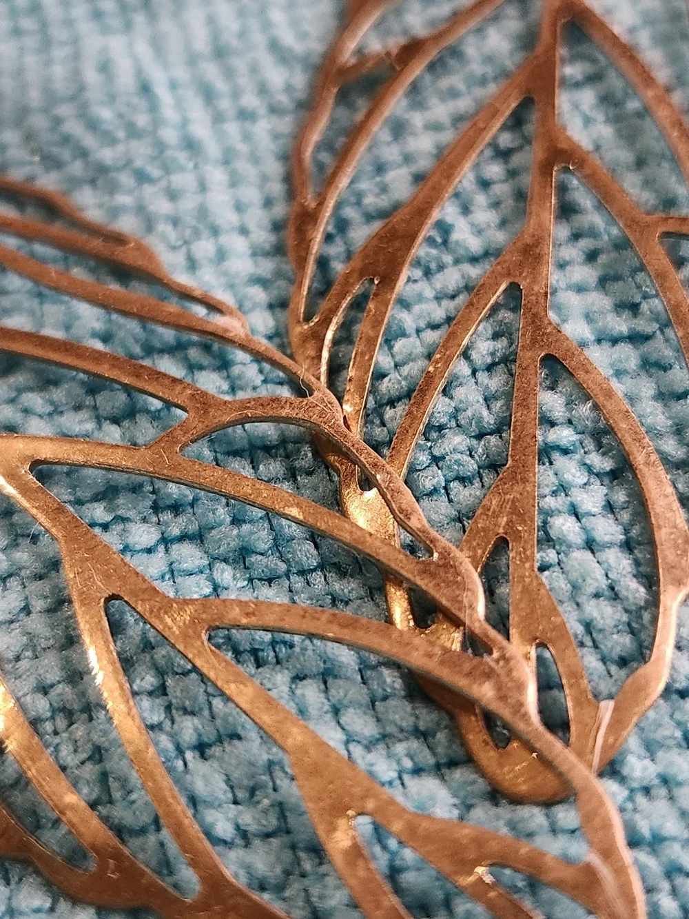 Delicate Cutout Leaf Dangle Earrings — Metallic Bronze